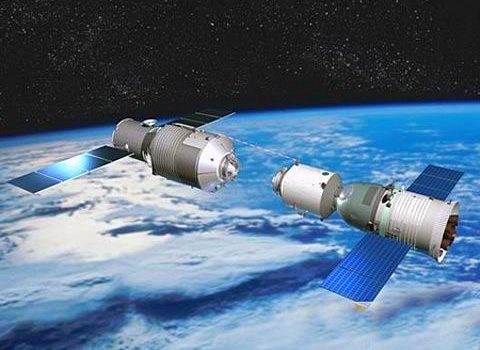 Artist's conception of the Tiangong-1 space station during rendezvous and docking with a Shenzhou spacecraft (Credit: Reuters).