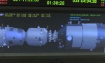 An animation of the Tiangong-1 module and Shenzhou-8 spacecraft as they dock is shown on a monitor at the mission's Beijing control center. (Credits: AP/Xinhua)