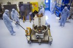 Technicians handle the Mars Science Laboratory's RTG at NASA Kennedy Space Center's Payload Hazardous Servicing Facility (Credits: NASA/Kim Shiflett).