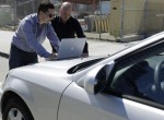iSEC security consultants Don Bailey (left) and Matthew Solnik unlock a car using M2M (Credits: Eric Risberg/AP).