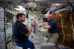 Astronaut Mark Kelly operating NanoRack based payloads (Credits: NanoRacks LLD).