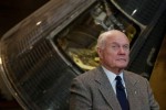 Former astronaut and US Senator John Glenn posing with the Friendship 7 capsule at the Washington DC Air and Space Museum in 2002 (Credits: Gannett News Service)