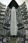 The OTV-1 in front of half of the Atlas V fairing awaiting encapsulation in 2010 (Credits: US Air Force).