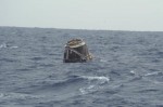 Dragon floating in the Pacific Ocean after a successful splash down (Credits: SpaceX).