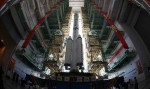Shenzhou-9 and its Long March-2F rocket preparing for a vertical transfer to the launch pad (Credits: Xinhua/Wang Jiamin).