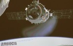 Shenzhou-9 pulling away from Tiangong-1 in preparation for manual docking (Credits: Xinhua).