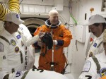 Commander Alan Poindexter (center) prepares to board Discovery for a countdown practice (Credits: Scott Andrews/NASA).