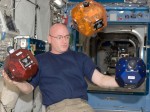 Astronaut Scott Kelly shows off the SPHERES satellites on ISS (Credits: NASA).