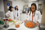 Scientist Maya Cooper demonstrates a Mars-ready vegan pizza (Credits: Michale Stravato/AP).
