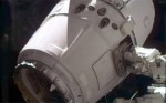 Dragon grappled by ISS robotic arm Canadarm2 (Credits: NASA).