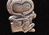 A Silver Snoopy pin (Source: WikiMedia).