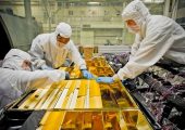 Adequate thermal insulation is critical to spacecraft operations. Here, engineers apply insulation blanketing to the James Webb telescope (Credits: NASA).