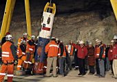 Rescue workers prepare to pull up Chilean miners trapped underground for 69 days using a capsule that incorporated suggestions from NASA (Credits: Alex Ibanez/AP).