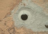The bore-hole at John Klein, showing the lesser oxidized grey powder (Credits: NASA.)