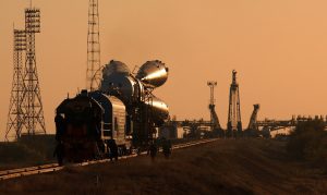 A Soyuz takes the train to the Baikonour launch pad (Credits: NASA).