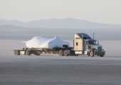 SNC's Dream Chaser test flight craft is hauled across the bed of Rogers Dry Lake at Edwards Air Force Base, Calif., to NASA's Dryden Flight Research Center on May 15. Image credit: NASA/Tom Tschida