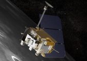 Artist's conception of NASA's Lunar Reconnaissance Orbiter above the Moon. The Cosmic Ray Telescope for the Effects of Radiation (CRaTER) instrument is visible in the center of the image at the bottom left corner of the spacecraft. (Credits: NASA).