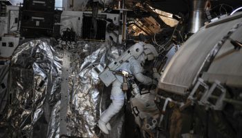 Luca Parmitano works on the routing of data and Ethernet cables during EVA-23 (Credits: NASA).