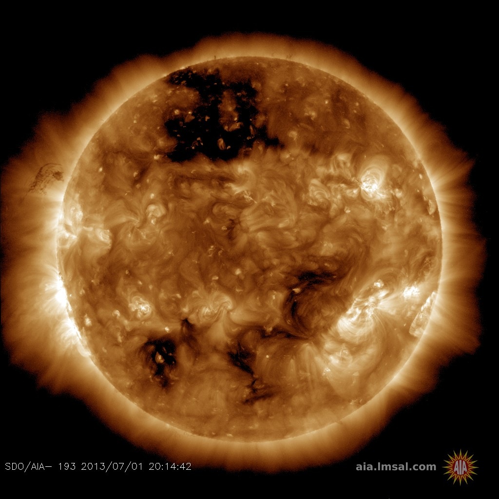 A massive coronal hole can be seen at the top of this solar image from SDO (Credits: NASA/AIA).