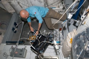 As part of preparations for the arrival of Cygnus, Luca Parmitano works to configure the Common Berthing Mechanism (CBM) Centerline Berthing Camera System (CBCS) inside the space station’s Harmony node last week (Credits: NASA).