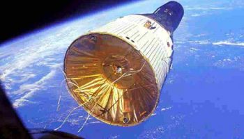 Gemini VII, bearing astronauts Frank Borman and Jim Lovell on a record-breaking 14-day mission, is seen through the windows of Gemini VI-A, with fellow spacefarers Wally Schirra and Tom Stafford. This mission, in December 1965, marked the first ‘true’ rendezvous between two piloted vehicles in orbit (Credits: NASA).