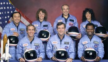 The Challenger STS 51-L crew, as it should be remembered: positive and brilliant individuals, happily striving to explore space and further humanity’s reach into the Universe. In the back row (lef to right) Ellison S. Onizuka, Sharon Christa McAuliffe, Greg Jarvis, and Judy Resnik. In the front row (lefto to right) Mike Smith, Dick Scobee, and Ron McNair (Credits: NASA).