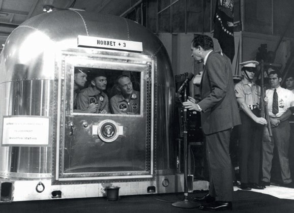 Apollo 11 crew are visited by US President Richard Nixon while quarantined in a special Mobile Quarantine Facility. Quarantine was abandoned after Apollo 14 (Credits: NASA).