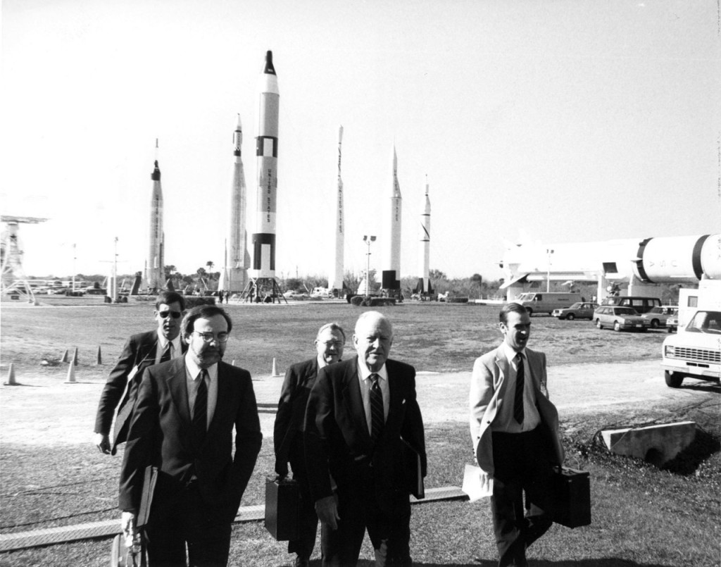 Here, Alton Keel (left), the representative to the Commission from the Executive Office of the President, and chairman William Rogers (center) arrive at the Galaxie Theatre at KSC's Visitor's Information Center for a one day briefing and tour of the NASA facility.