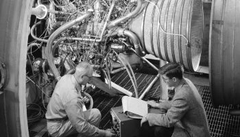 engineers test the RL-10 engine in NASA Lewis (now Glenn) Research Center's Propulsion Systems Laboratory. Developed by Pratt & Whitney, the engine was designed to power the Centaur second-stage rocket. Centaur was responsible for sending the Surveyor spacecraft on its mission to land on the moon and to explore the surface in the early stages of the Apollo Program. Credits: NASA