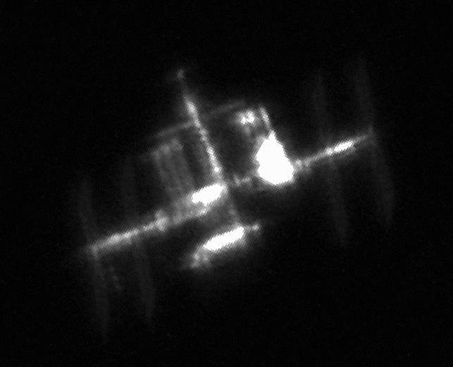 The ISS photographed on April 9 when the Dragon CRS-8 was orbiting, trailing by one minute. (credit: Ralf Vandebergh)