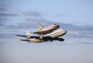 Shuttle Discovery flying on top of a Boeing 747 Shuttle Carrier Aircraft (Credits: NASA).