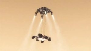In its final phase of descent, Curiosity will be lowered to the ground by a Skycrane hovering above on jetpacks (Credits: NASA).