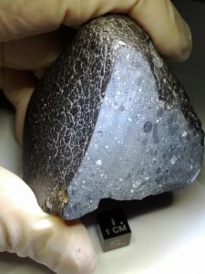 The Martian meteorite NWA 7034 "Black Beauty" is made of rapidly cooled lava.   (Credit: NASA )