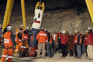Rescue workers prepare to pull up Chilean miners trapped underground for 69 days using a capsule that incorporated suggestions from NASA (Credits: Alex Ibanez/AP).