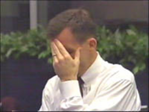 LeRoy E. Cain, NASA entry flight director, realizes the loss of the crew following the Columbia disaster