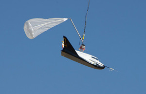 Helicopter air-drop test of a 15% scale modle of Dream Chaser conducted in 2010 (Credits: NASA).