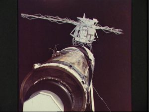 Although the deployment of the Apollo Telescope Mount (ATM), in the background, was considered relatively complex in terms of its criticality, no one could have foreseen that Skylab’s solar arrays and micrometeoroid shield would almost ruin the mission. In this view from Pete Conrad’s crew, the tattered wiring and tubing from the torn solar array are clearly visible (Credits: NASA).
