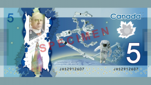Canada's new $5 bill sports ISS robotic arms Dextre and Canadarm 