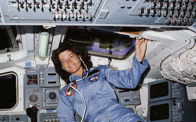 STS-7 Mission Specialist Sally Ride poses on aft flight deck with her back to the on orbit station (Credit: NASA).