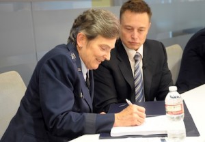 Lt. Gen. Ellen Pawlikowski, commander of SMC, and SpaceX CEO Elon Musk signed a cooperative research and development agreement to help certify SpaceX's Falcon 9 rocket for military launches. Credit: U.S. Air Force/Joe Juarez
