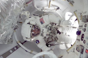 Astronaut James Reilly exiting ISS through the Quest airlock (Credits: NASA).