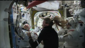 Parmitano helped by the crew to take his helmt off  (Credits:  NASA TV)