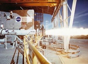 Test firing an American Rocket Company (AMROC) hybrid rocket motor at NASA's Stennis Space Center in 1994 (Credits: NASA). 