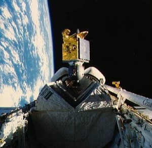 The American Satellite Company’s ASC-1 communications satellite spins out of Discovery’s payload bay, early in the 51I mission. Note the Pacman-like jaws of the satellite’s protective sunshield (Credits: NASA).
