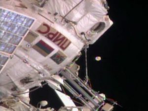 No, that object hovering just off ISS is not alien in origin: it is an antenna cover broken off the Zvezda module (Credits: NASA).