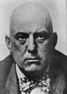 Aleister Crowley, looking quite evil. (Public domain image).