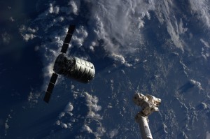 The Cygnus cargo spacecraft is just a few feet away from the International Space Station's Canadarm2 (Credits: NASA).