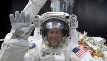 Mission Specialist Mike Massimino on EVA in 2002 to replace the Hubble's port solar array (Credits: NASA).