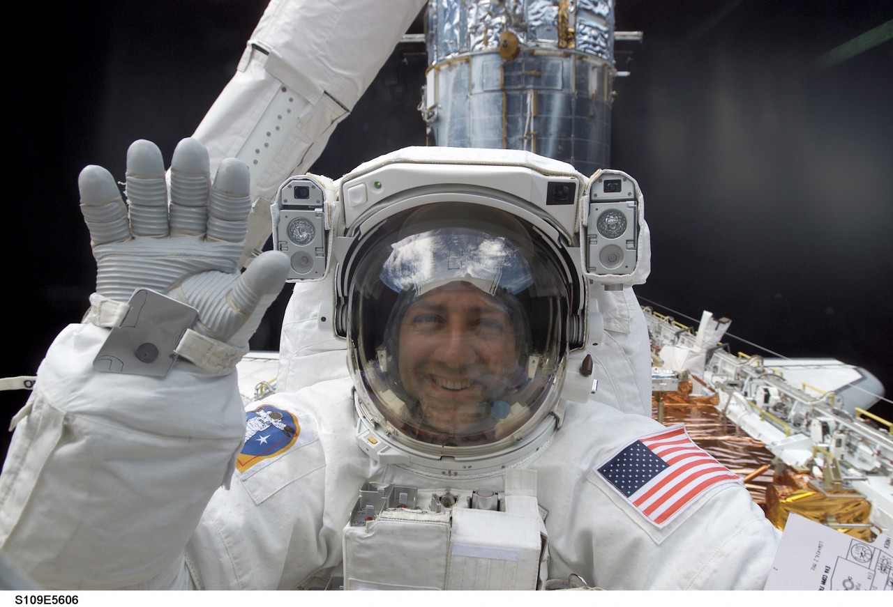 Mission Specialist Mike Massimino on EVA in 2002 to replace the Hubble's port solar array (Credits: NASA).