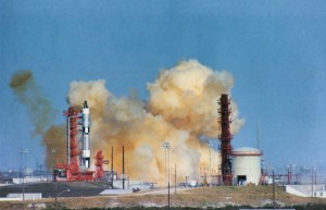 Clouds of smoke hang ominously around Pad 19 as Gemini VI’s Titan sits motionless in the seconds after the abort. Note the absence of an escape tower atop the Titan; in an emergency, Schirra and Stafford would have used ejection seats. Many astronauts doubted the reliability and survivability of the seats, which factored into Schirra’s decision not to use them that day (Credits: NASA).